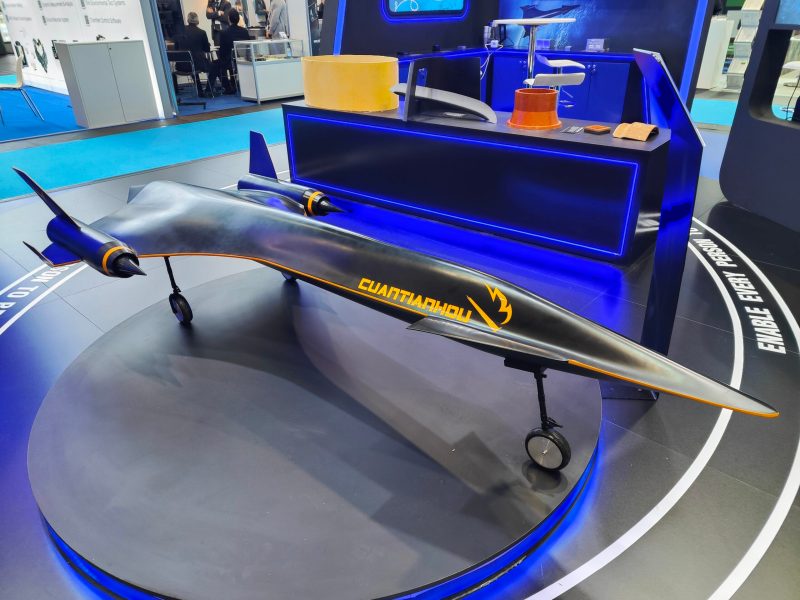Model of the Cuantianhou spaceplane displayed at Space Tech Expo Europe 2024, showcasing its sleek black design with orange accents, dual engines, and aerodynamic features for hypersonic travel.