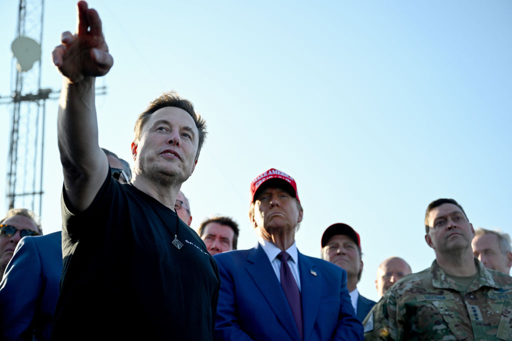 Self-proclaimed "First Buddy" Elon Musk gestures while discussing the sixth Starship test launch with President-elect Donald Trump at Starbase in Boca Chica, Texas. To the right of Trump is Gen. Chance Saltzman, Chief of space operations for the U.S. Space Force.