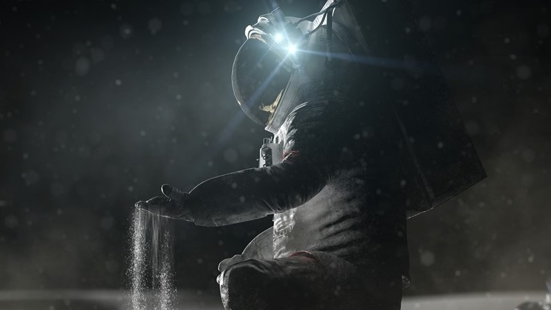 Image showing an astronaut on the moon sifting dust through their fingers.