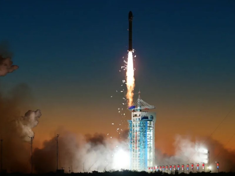 Long March 2C rocket carrying the SuperView Neo-2 03 and 04 satellites launches into the night sky from the Jiuquan Satellite Launch Center on November 24, 2024, with visible insulation tiles shedding from the upper stage during ascent.
